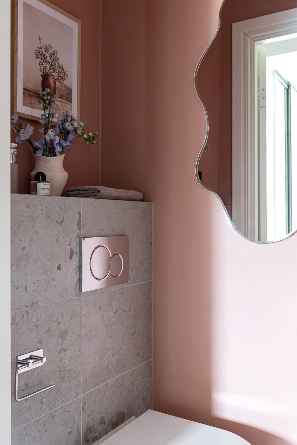 A Stylish Renovated Stockholm Apartment with Built-In Storage 21 toilet with light pink walls