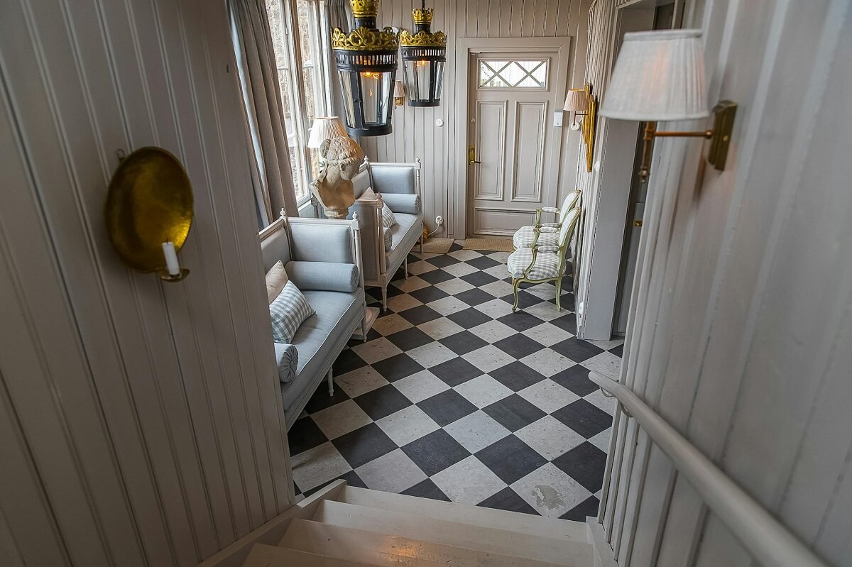 A Classic and Luxurious Lakeside Home in Sweden 3 view into hall with checkerboard floor luxurious summer house sweden nordroom