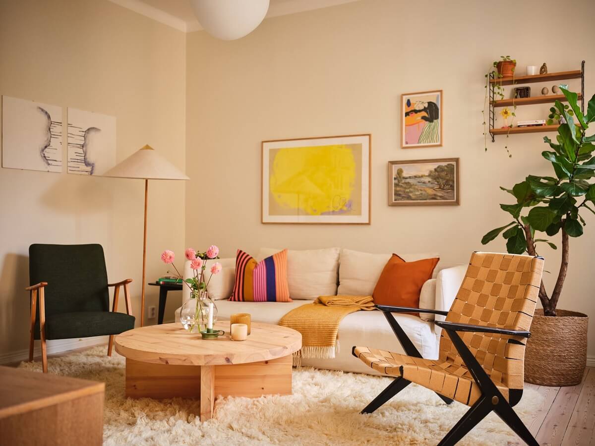 A Light Apartment with a Sage Green Kitchen 1 light colored living room