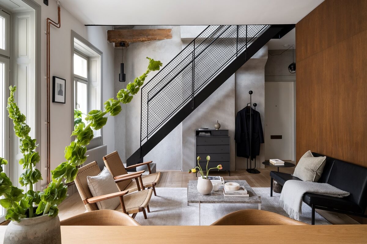 open plan living space with steel staircase