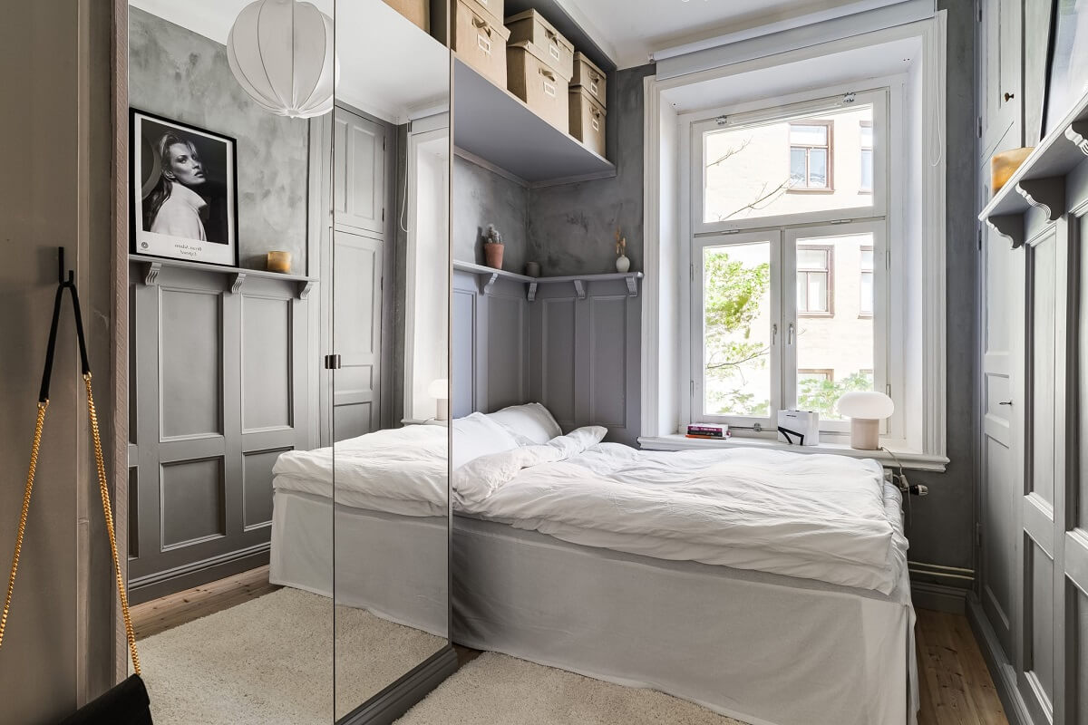 A Small Stockholm Apartment with a Gray Bedroom & Sunny Balcony 8 small gray bedroom with mirror wardrobe