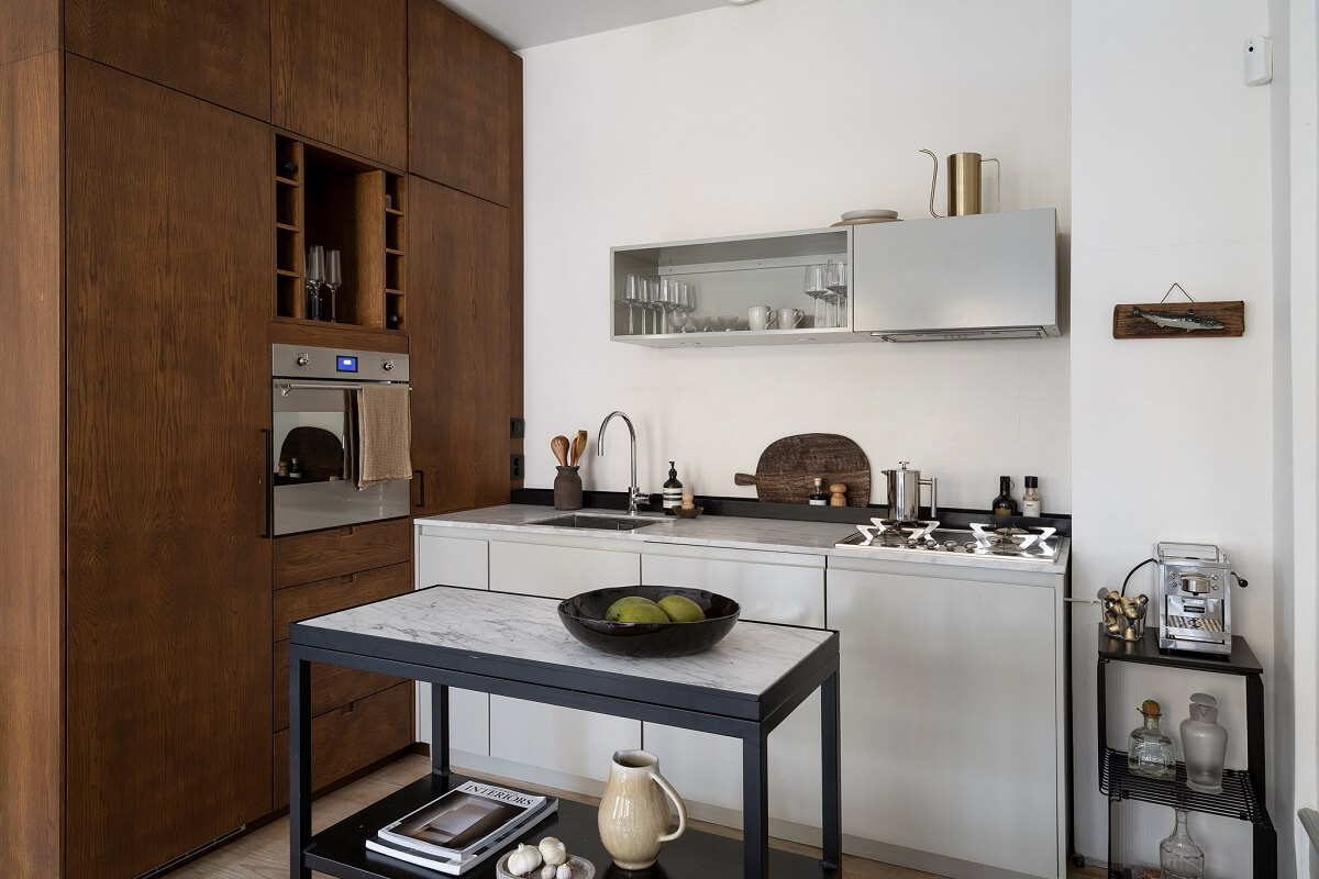 A Stylish Scandinavian Duplex with Custom-Made Cabinets 11 small kitchen with floor to ceiling wooden cabinets