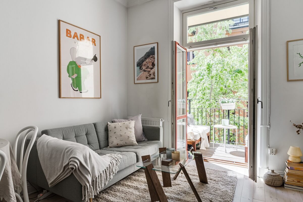 A Small Stockholm Apartment with a Gray Bedroom & Sunny Balcony 3 small living room with balcony