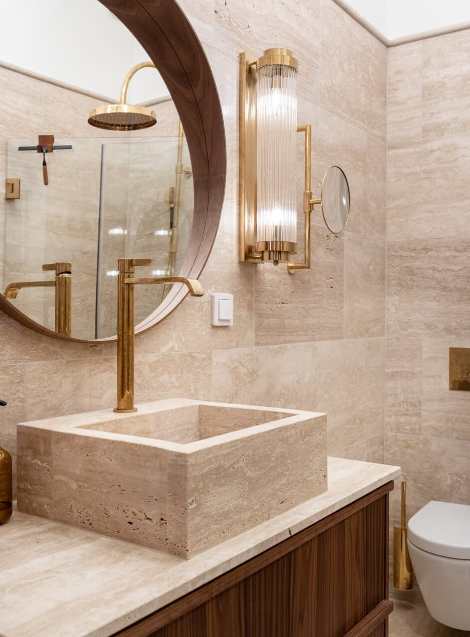 A Luxurious Stockholm Apartment with Period Features 22 bathroom sink and round mirror