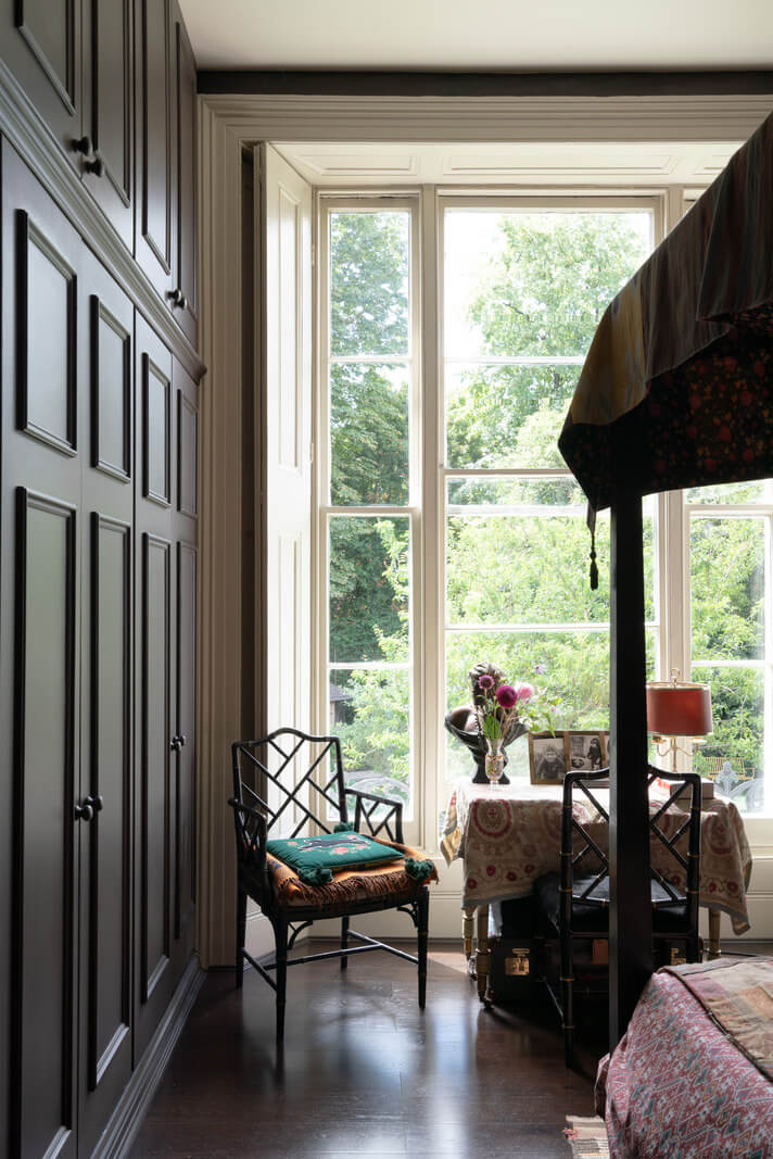 A Moody Color Palette and Eclectic Interiors in a London Apartment 12 bedroom with floor to ceiling wardrobes