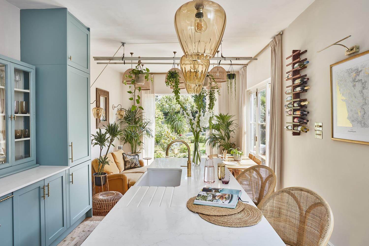 Playful Materials, Textures, and Colors in a London Home 10 blue kitchen with island