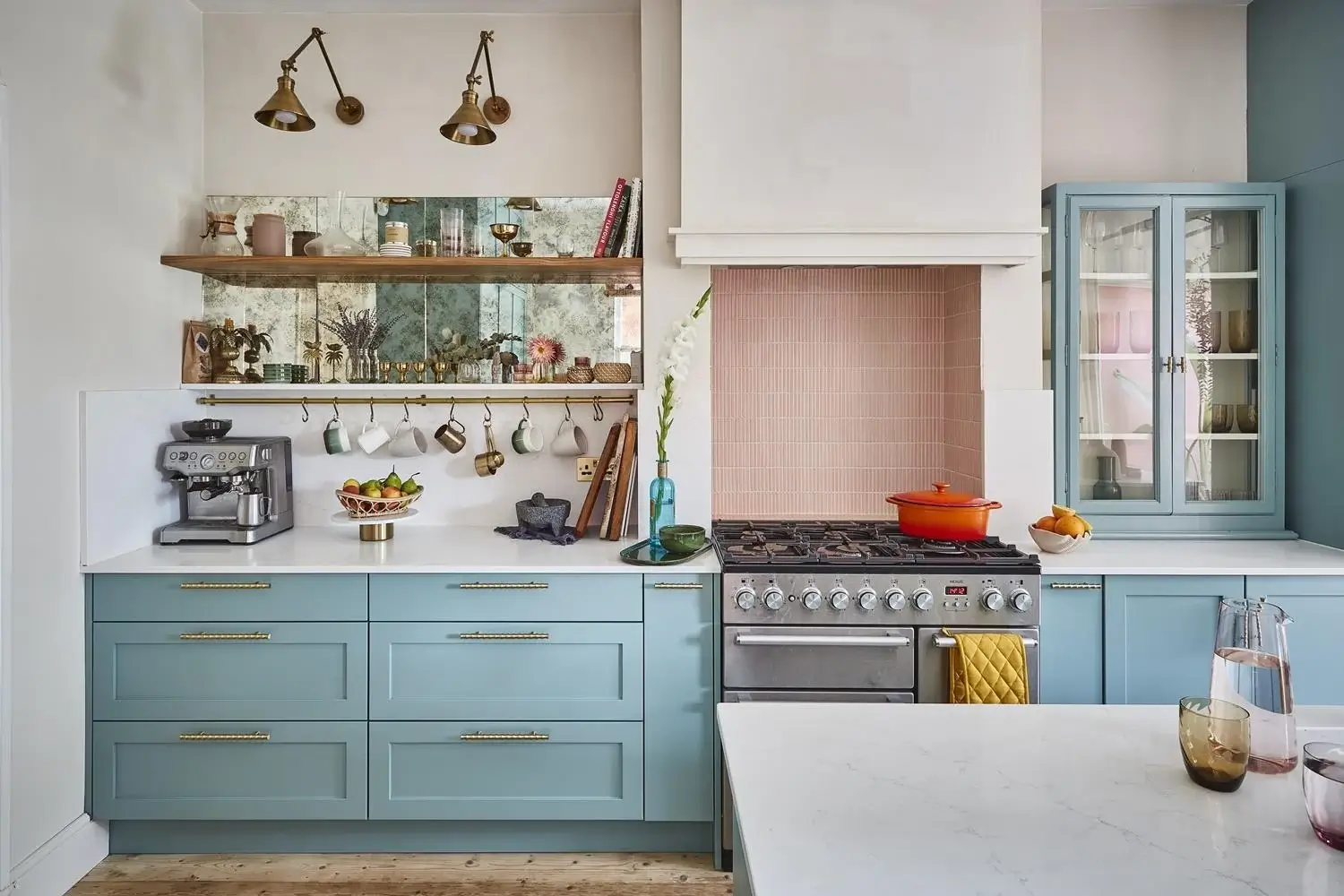 Why Everyone’s Adding Mirrors to Their Kitchens (And You Should Too) 20 blue kitchen with mirrored splashback and shelves