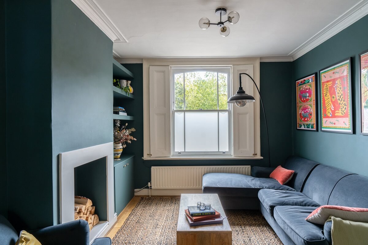 Blue Tones in a Two-Bedroom Victorian Cottage 2 blue sitting room with fireplace