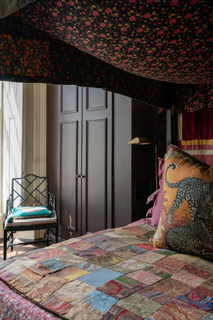 A Moody Color Palette and Eclectic Interiors in a London Apartment 13 colorful textiles canopy bed nordroom