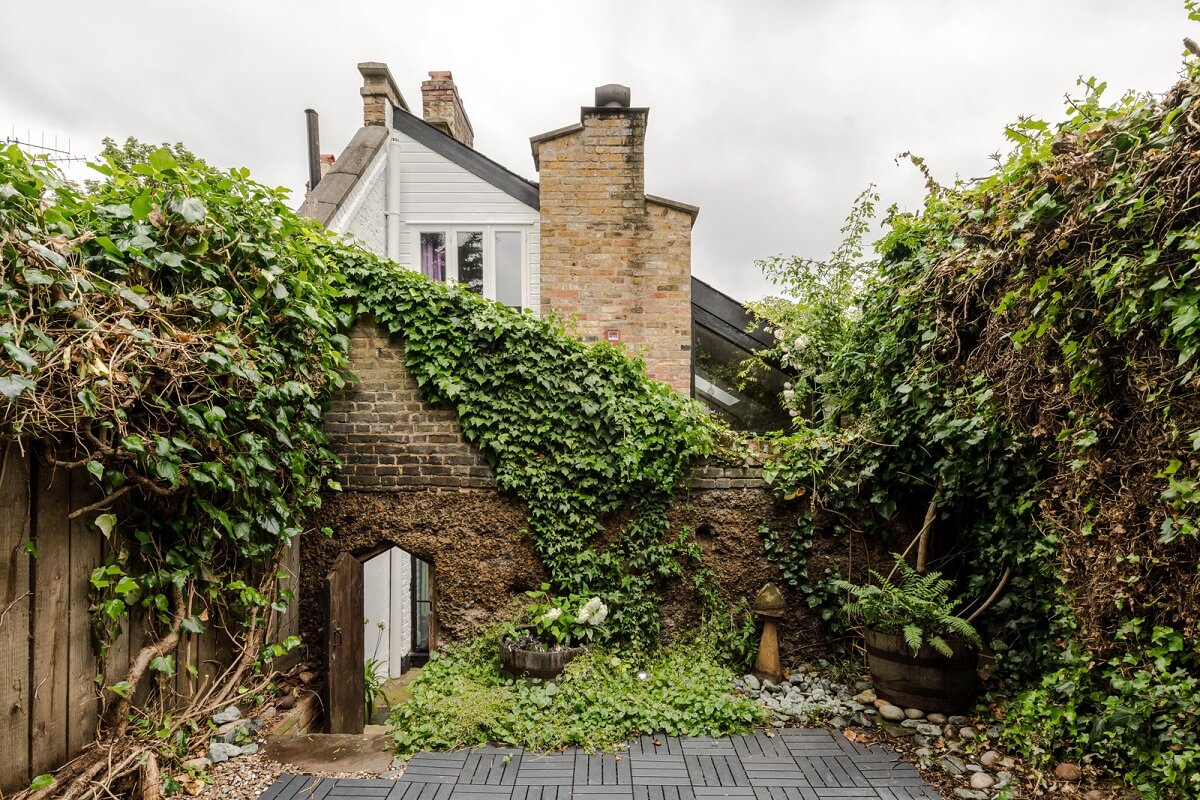 Exposed Materials and Green Tones in a London Stable Conversion 19 garden