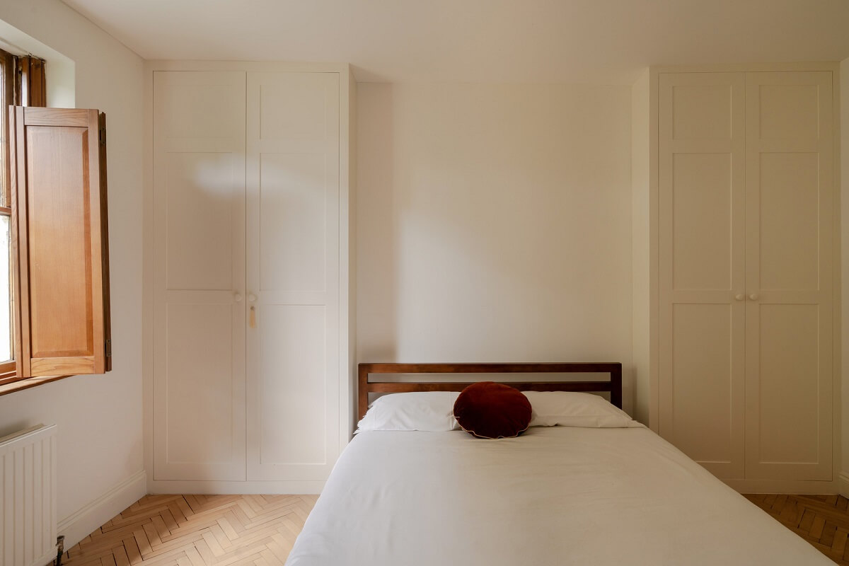Pared Back Interiors and Light-Filled Spaces in a London Apartment 10 light bedroom with built in wardrobes
