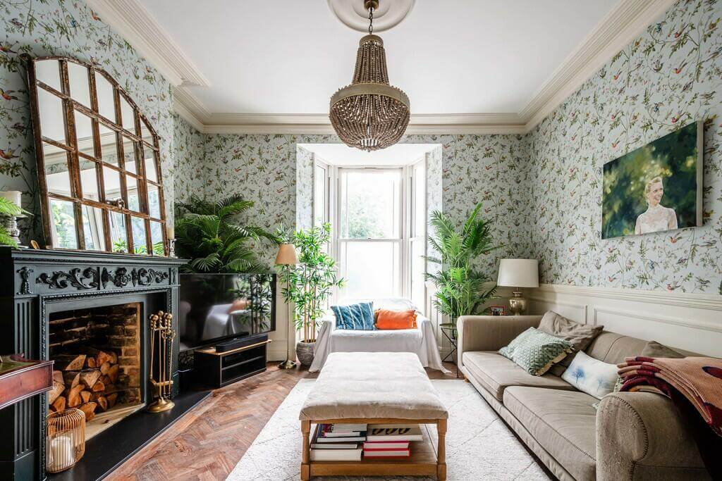 An Open Plan Victorian House with a Lush Green Garden 1 living room with wallpaper and fireplace An Open Plan Victorian House with a Lush Green Garden