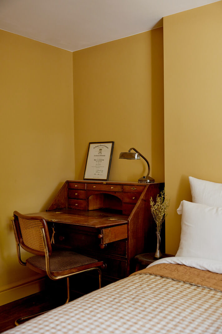 A Charming London House with an Ochre Yellow Bedroom 15 ochre yellow walls bedroom with vintage desk