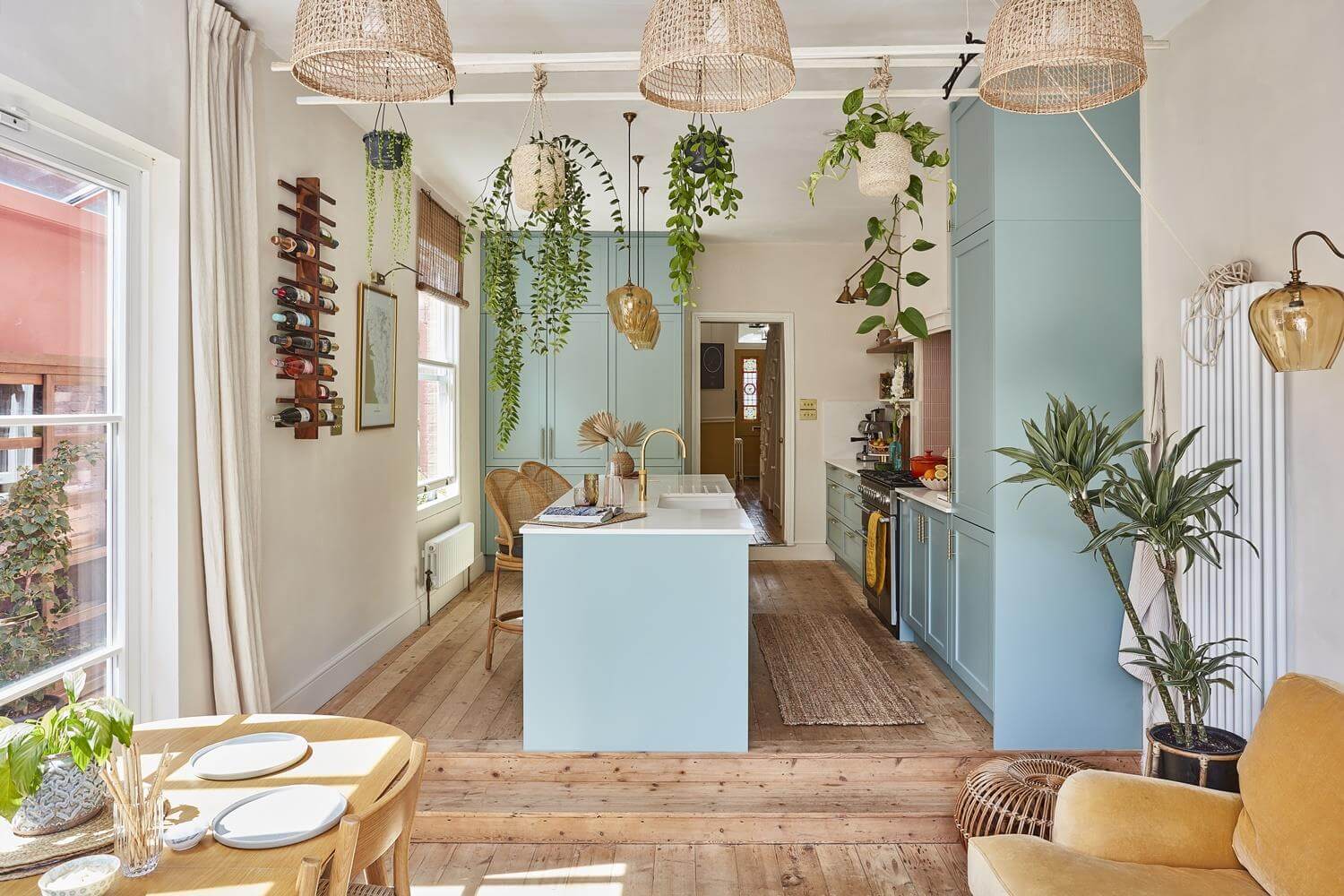 Best of 2024: Kitchens 34 open plan kichen living room with blue cabinets and wooden floor