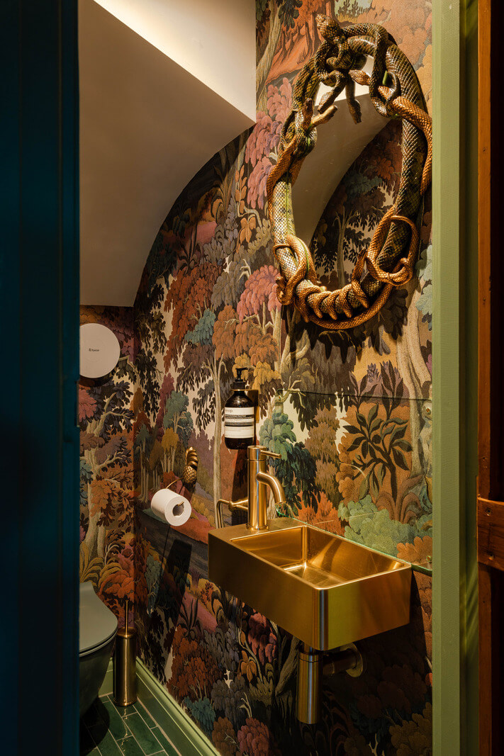 Exposed Materials and Green Tones in a London Stable Conversion 9 powder room with wallpaper