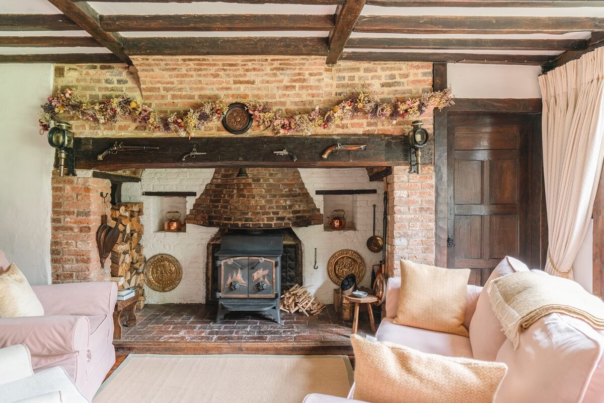 Magnificent Period Features in an English Tudor House 3 sitting room with brick fireplace