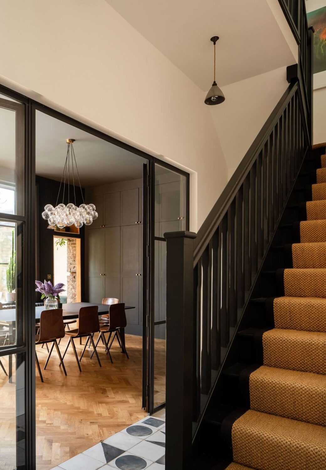A Stunning Color Palette in an Extended Edwardian House in London 5 staircase and geometric tiles