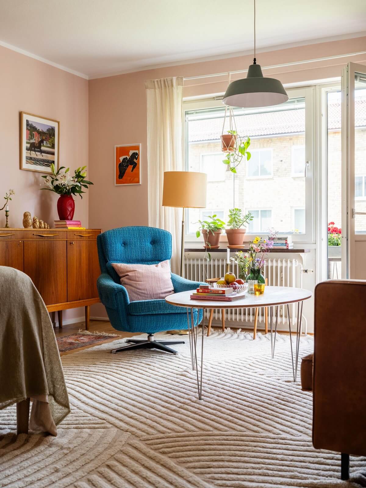 studio apartment striped rug and red chair
