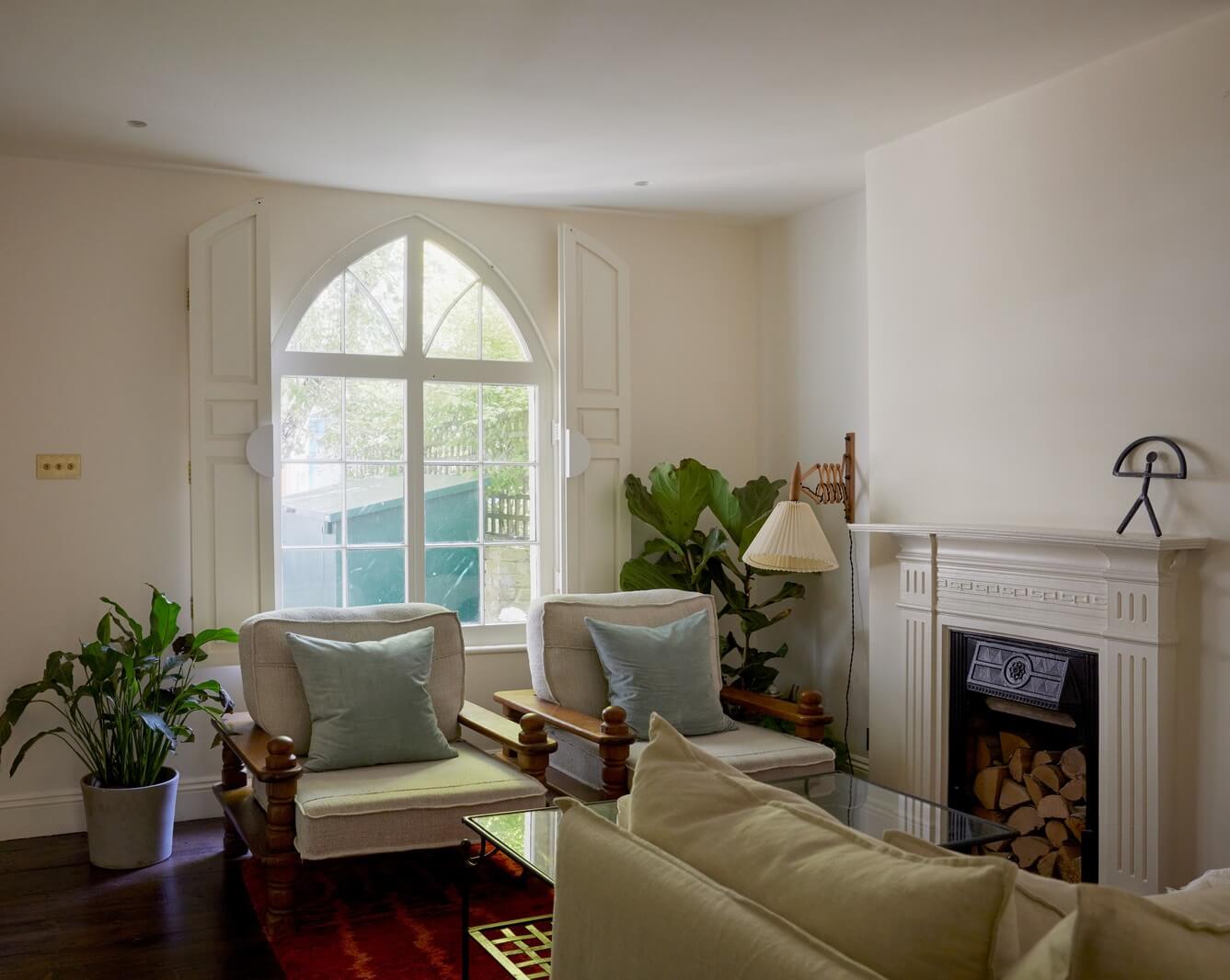 A Charming London House with an Ochre Yellow Bedroom 1 white living room arched window