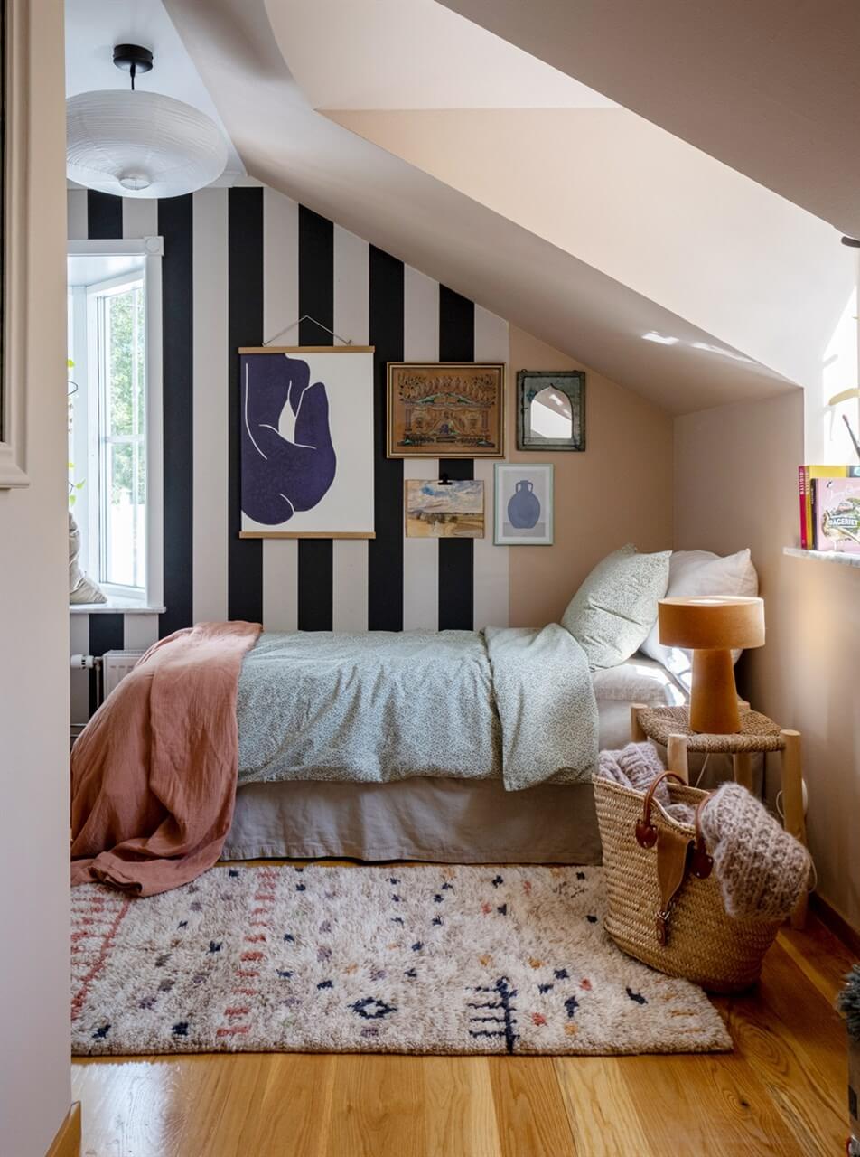A White Swedish Villa with a Veranda and a Swimming Pool 20 childrens bedroom with slanted ceiling and striped wallpaper nordroom