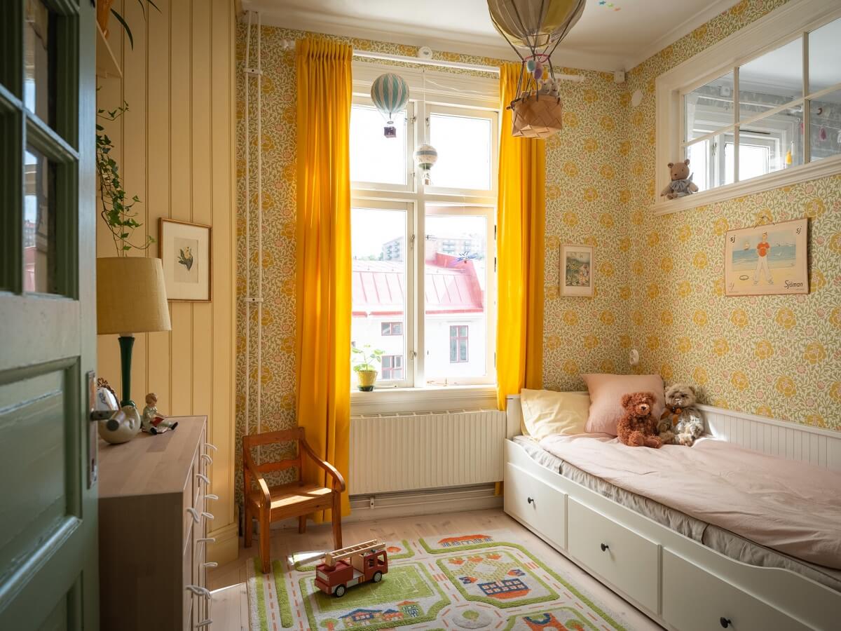 Charming Vintage Country Style in a Family Apartment in Sweden 22 childrens bedroom with yellow walls and wallpaper nordroom