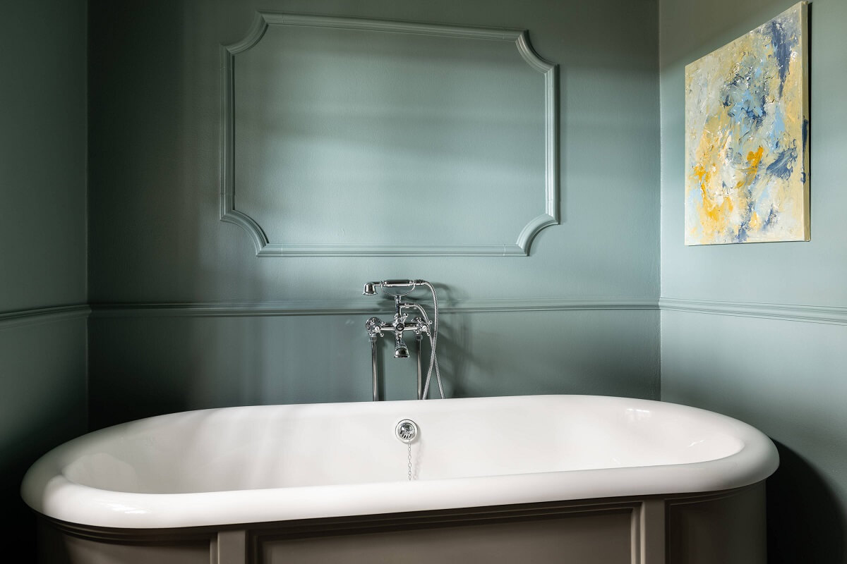 A Yellow Swedish Villa with Views of the Sea 22 freestanding bath with bluegreen wall