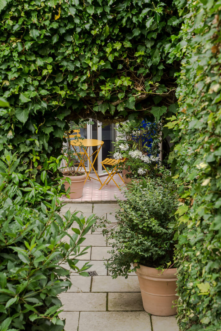 A London Apartment with a Deep Olive Green Kitchen 14 green city garden