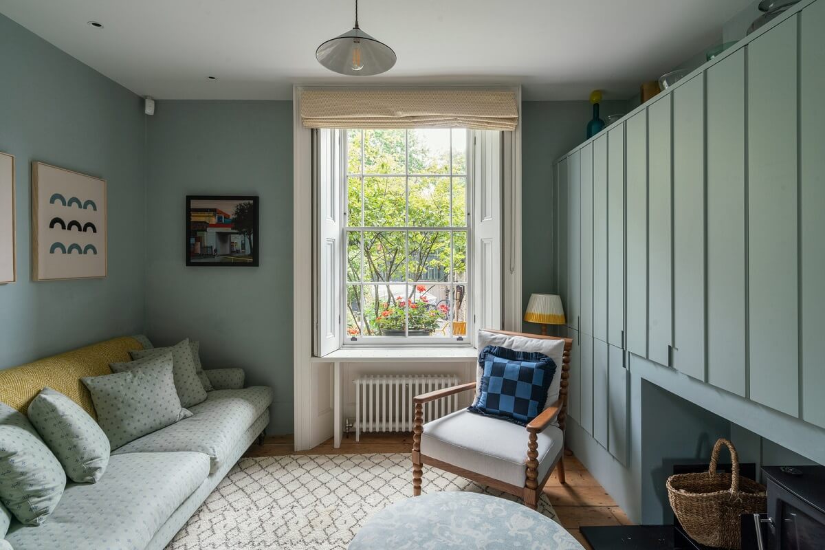 A Beautiful London Family Home with Colorful Accents 1 living room with custom storage wall nordroom