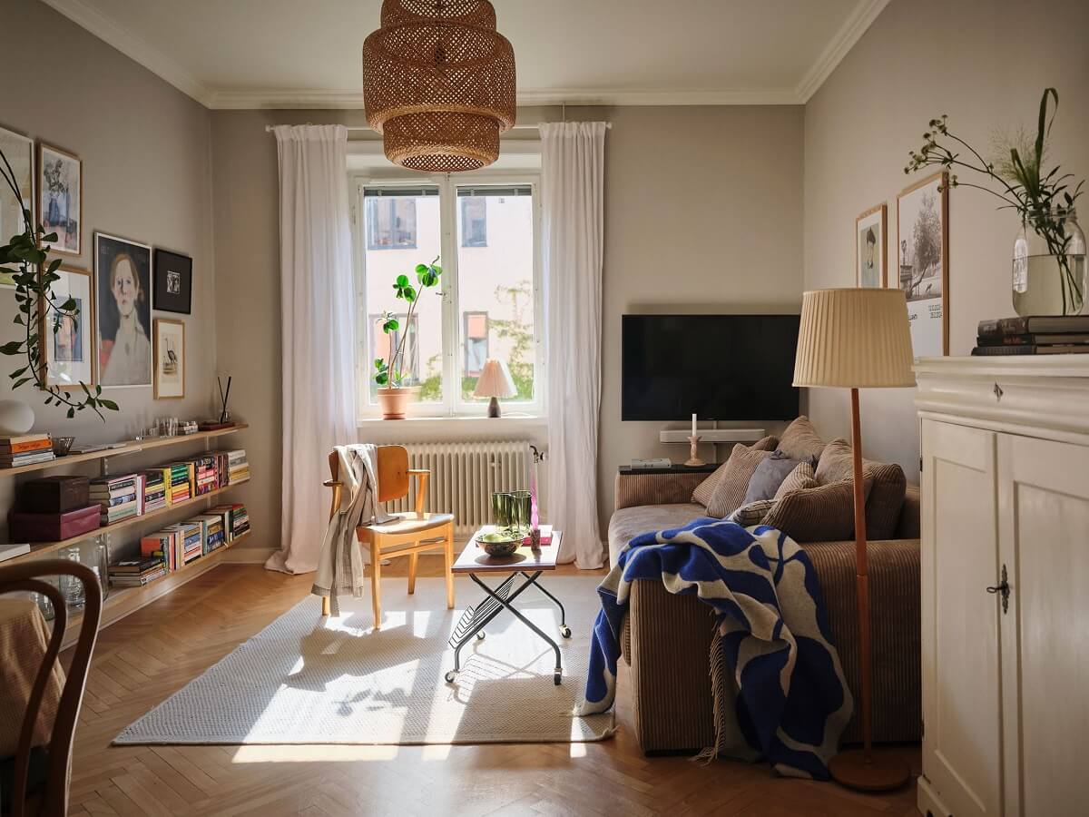 Muted Gray, Green, and Yellow Walls in a Stockholm Apartment 1 living room with gray walls and parquet floor