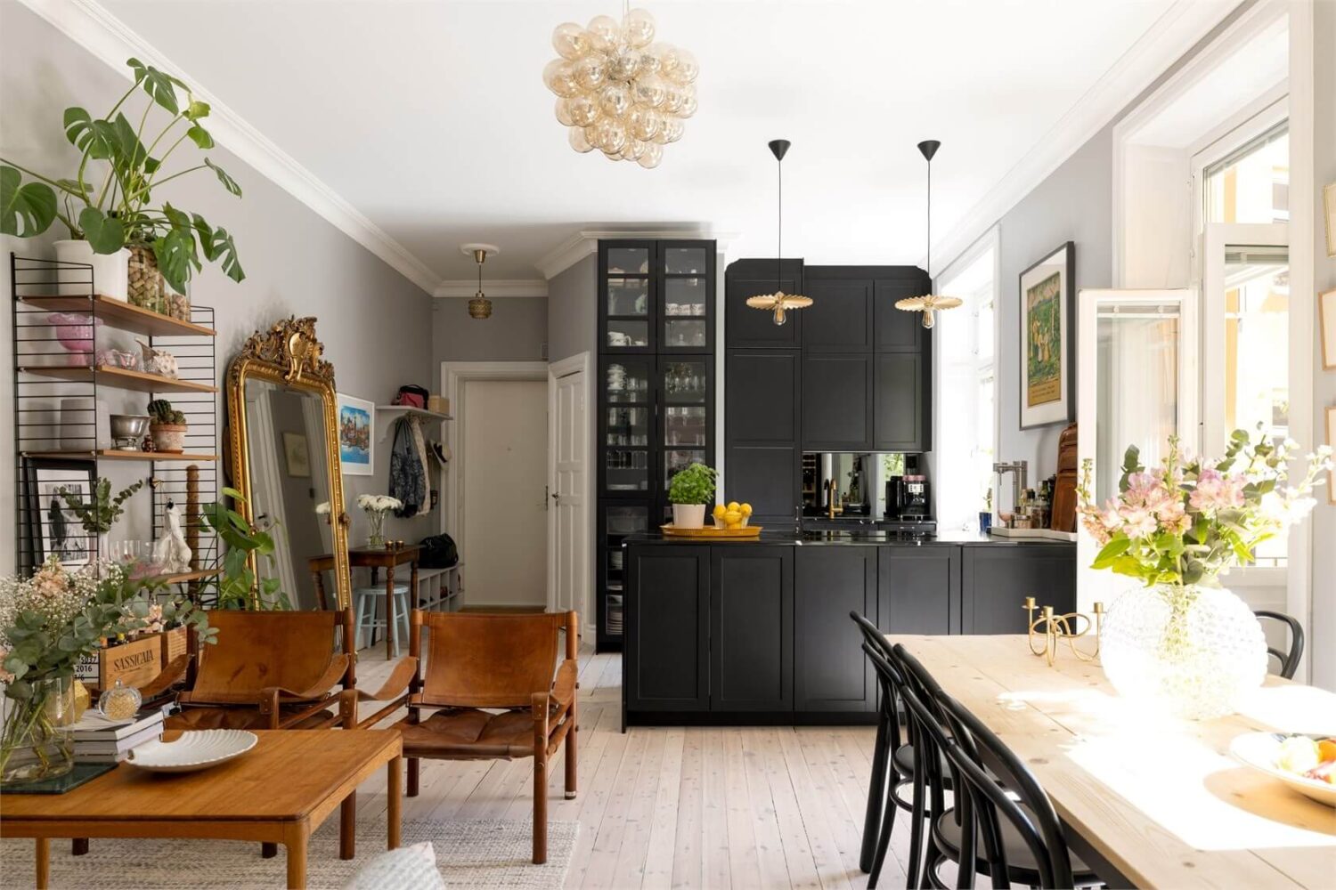A Lovely Stockholm Apartment with a Black Kitchen and Pink Bedroom 1 open plan living room and kitchen
