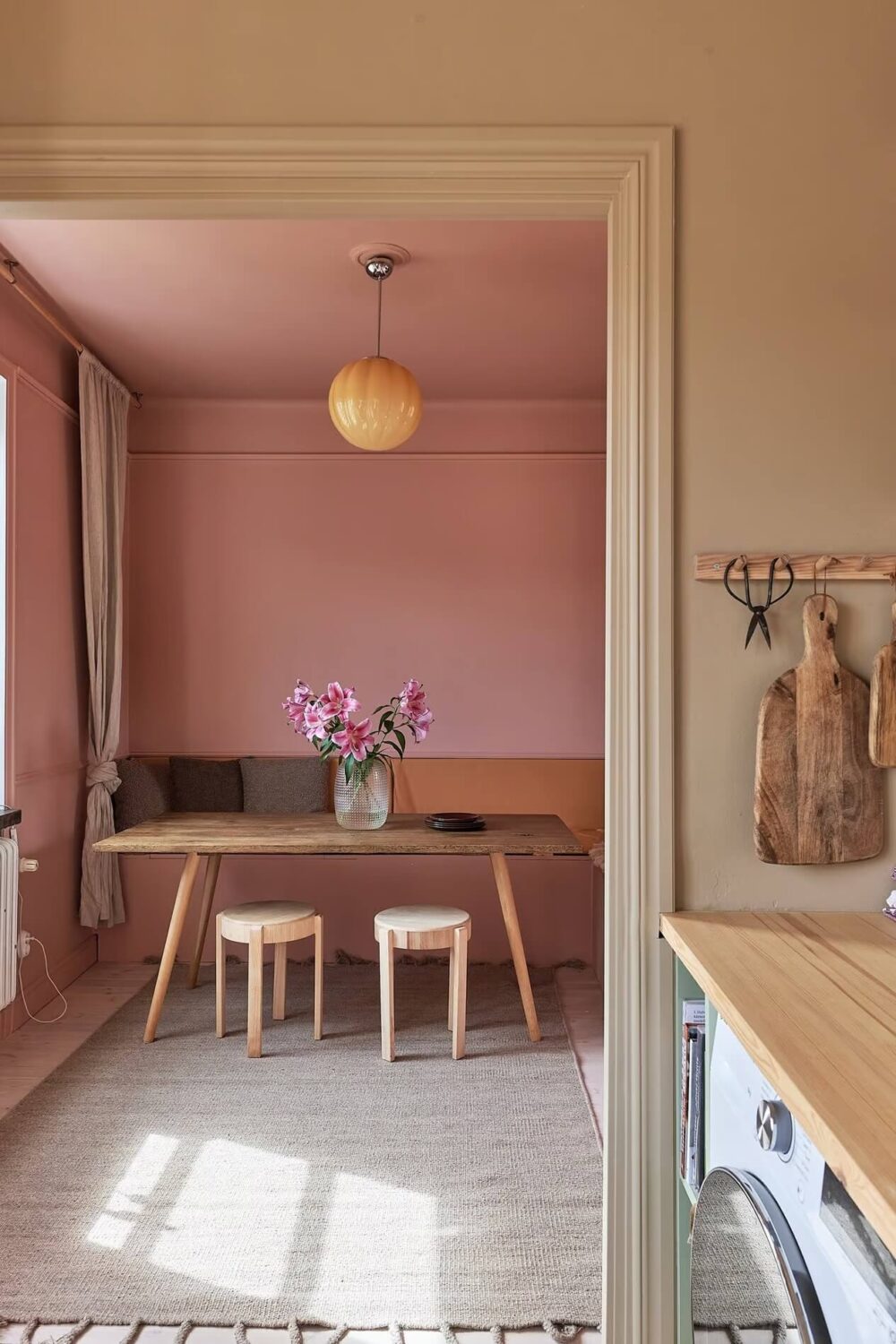 Warm Color-Drenched Rooms in a Swedish Apartment 12 pink dining room