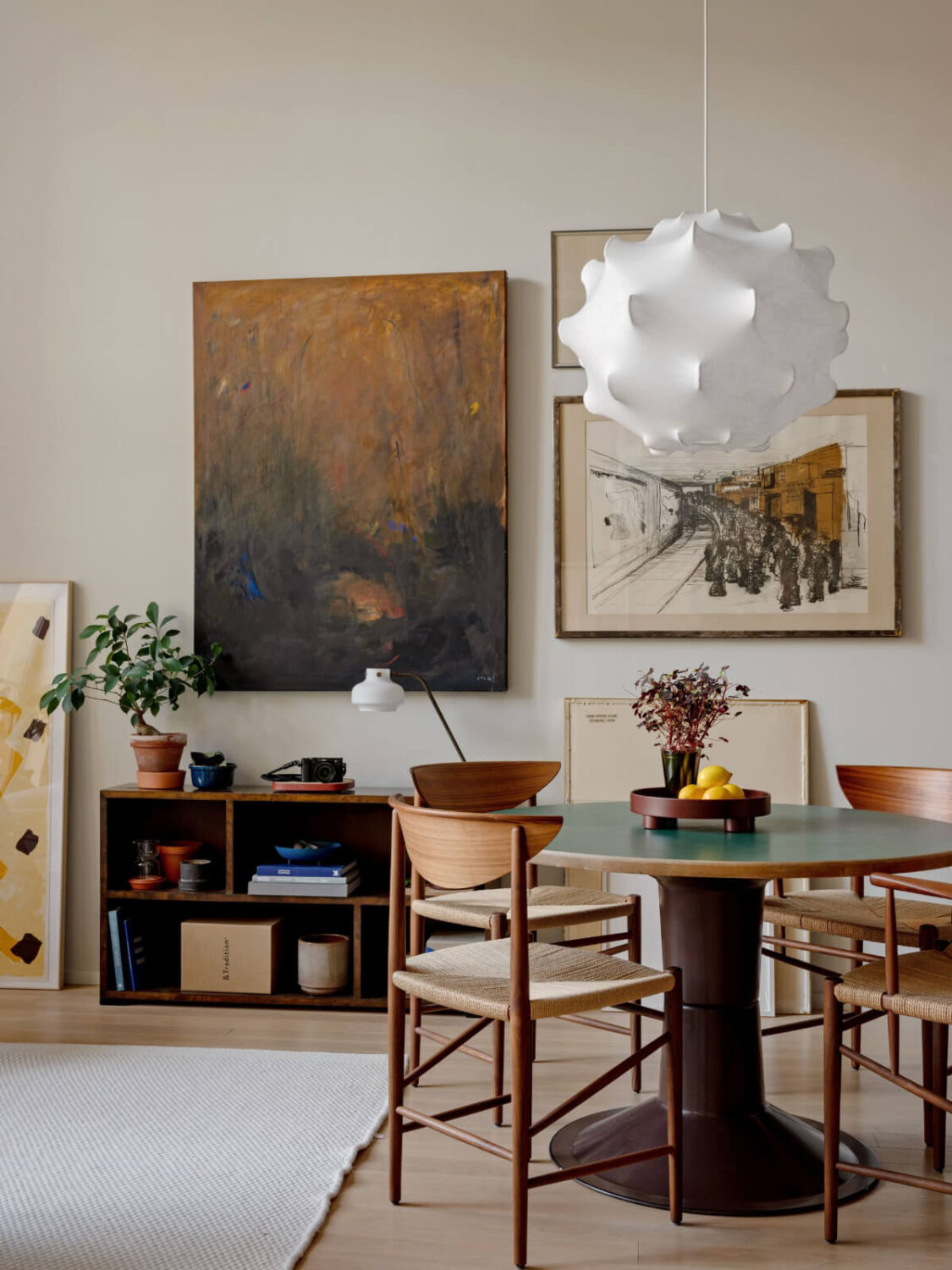 A Monochrome Loft with High Ceilings and Art 13 round dining table and art