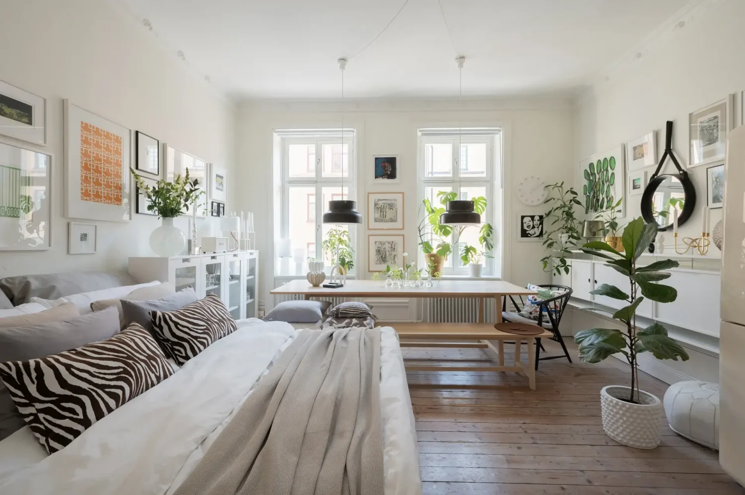 A Small Bright Scandinavian Studio Apartment 1 white studio apartment with large table