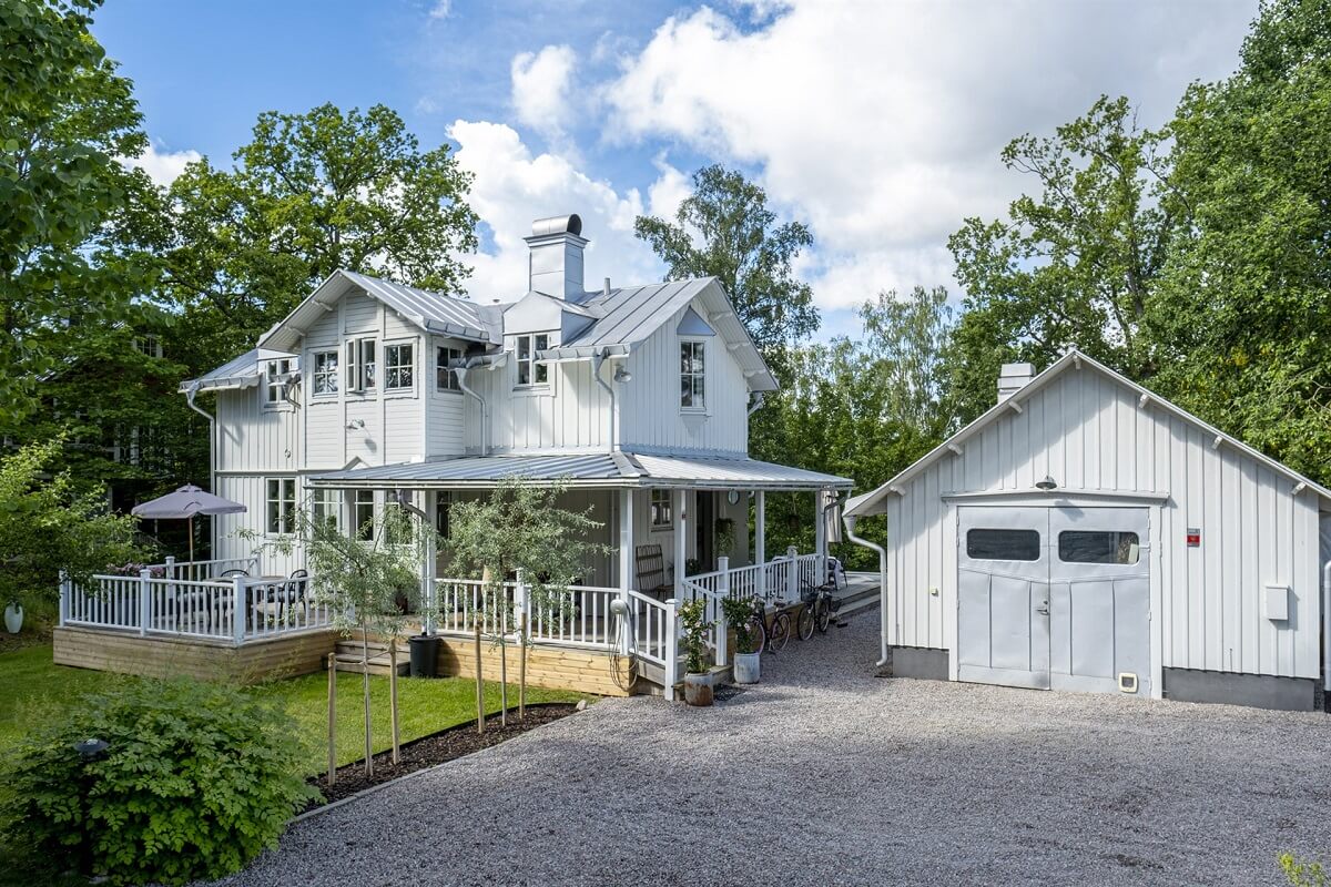 A White Swedish Villa with a Veranda and a Swimming Pool 1 white swedish villa with veranda