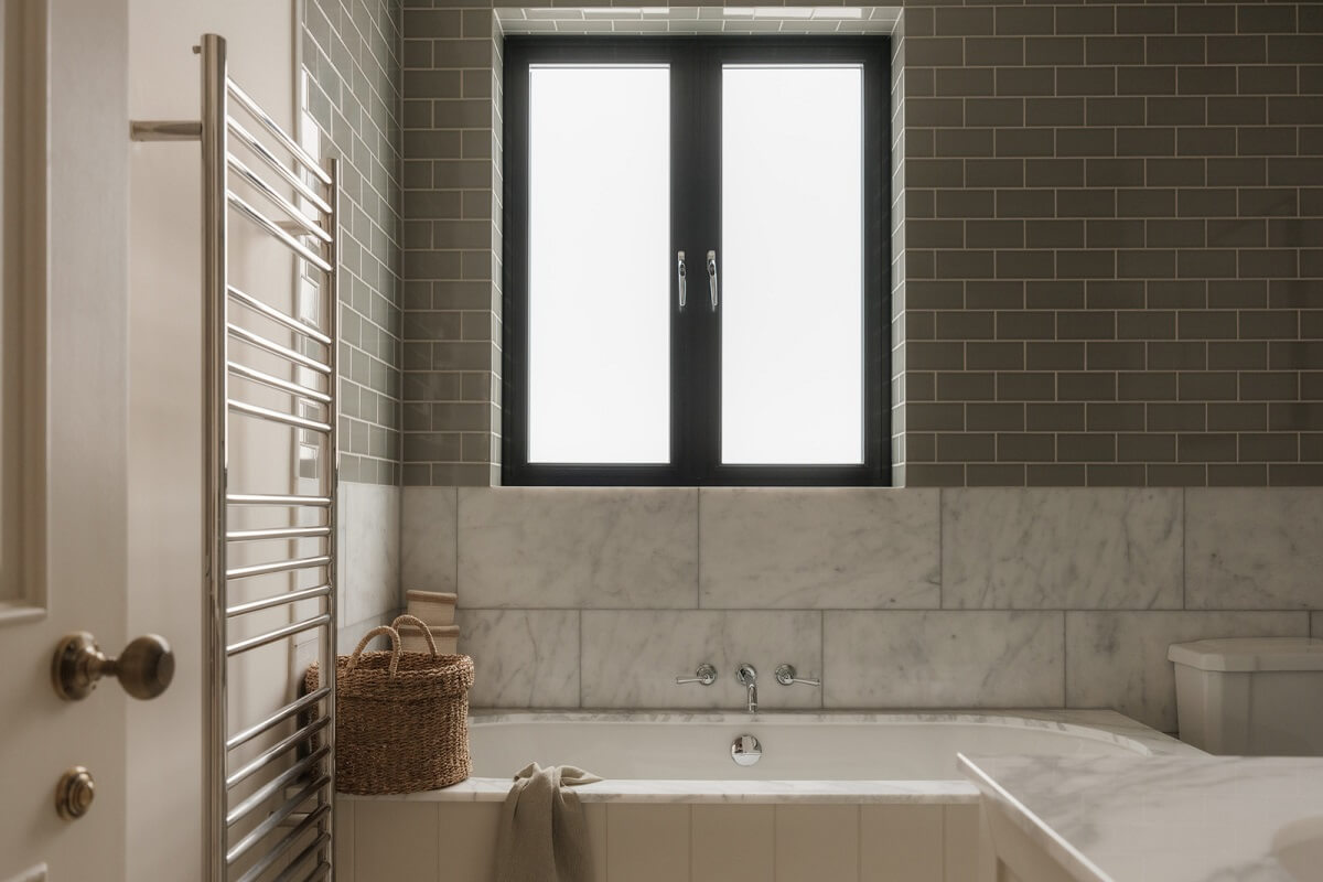 A Calm Color Palette and Warm Materials in a London Home 22 bathroom marble and gray tiles