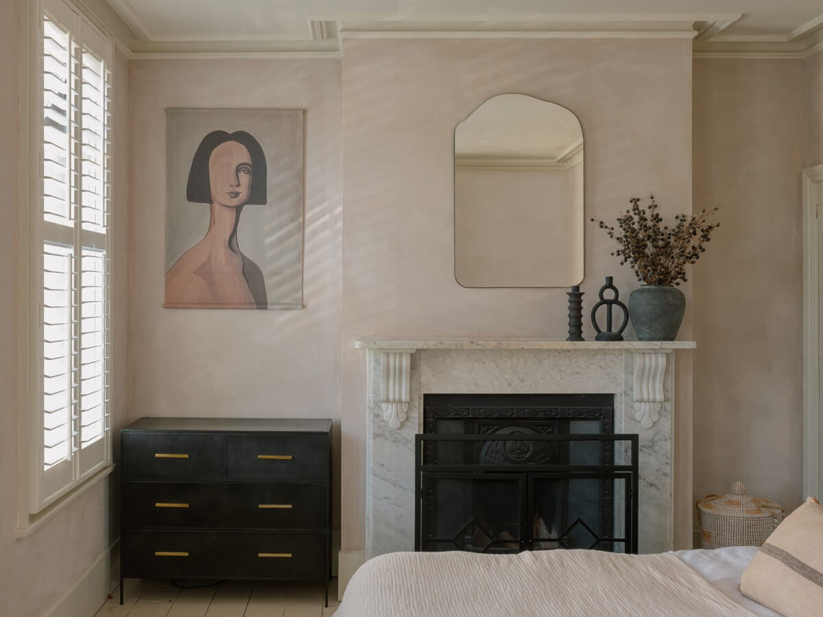 An English House with Carefully Restored Period Features 16 bedroom light pink plaster walls fireplace nordroom