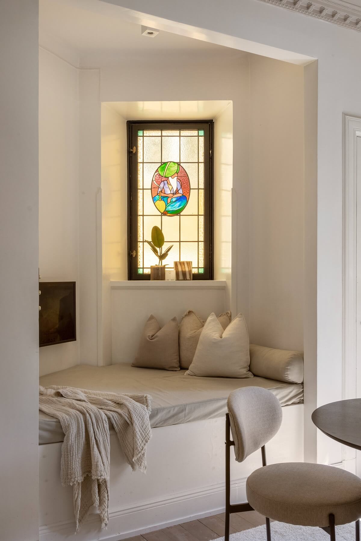 built in sofa with stained glass window nordroom