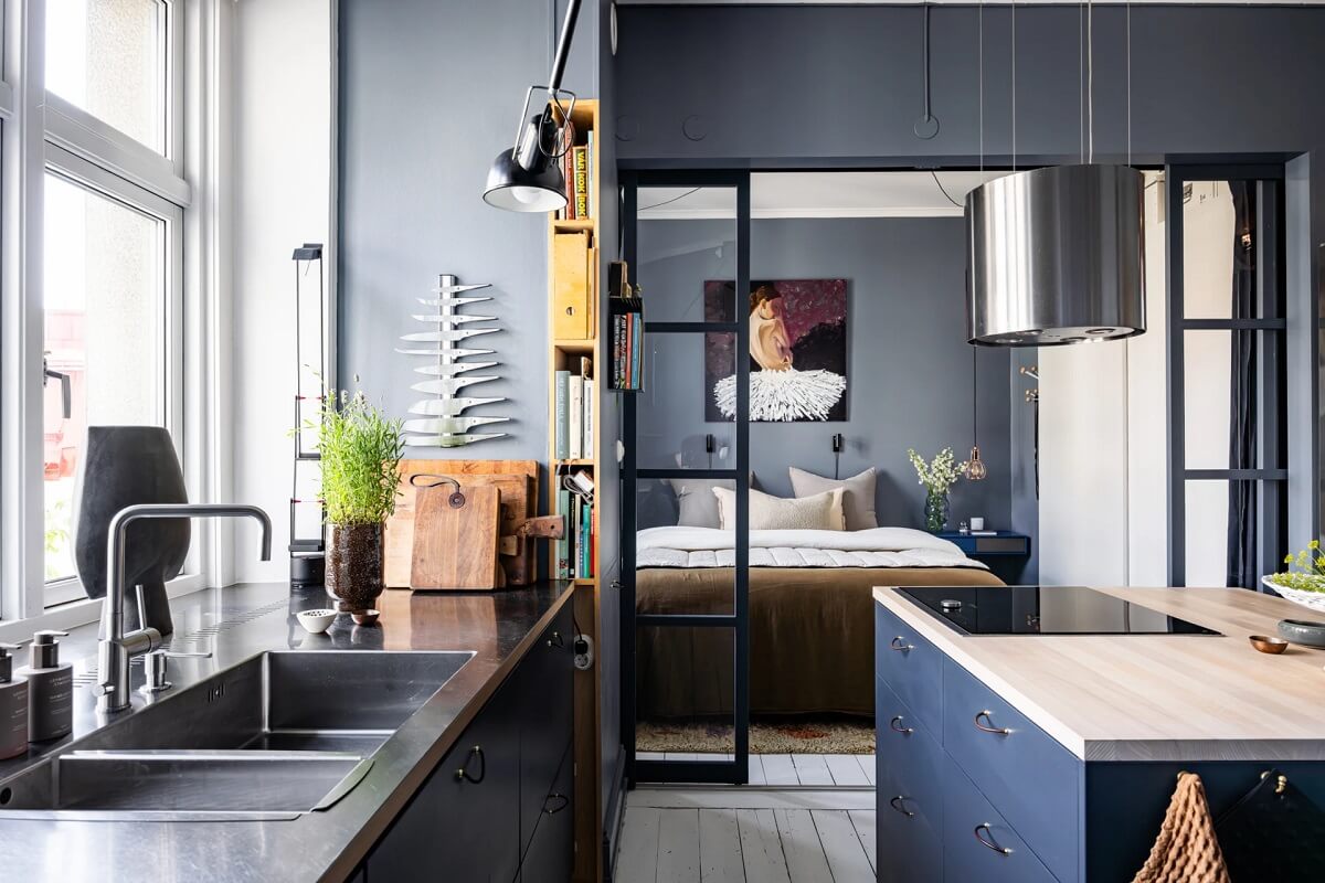 A Swedish Apartment with a Moody Kitchen and Bedroom 10 dark bedroom with steel doors to bedroom A Swedish Apartment with a Moody Kitchen and Bedroom