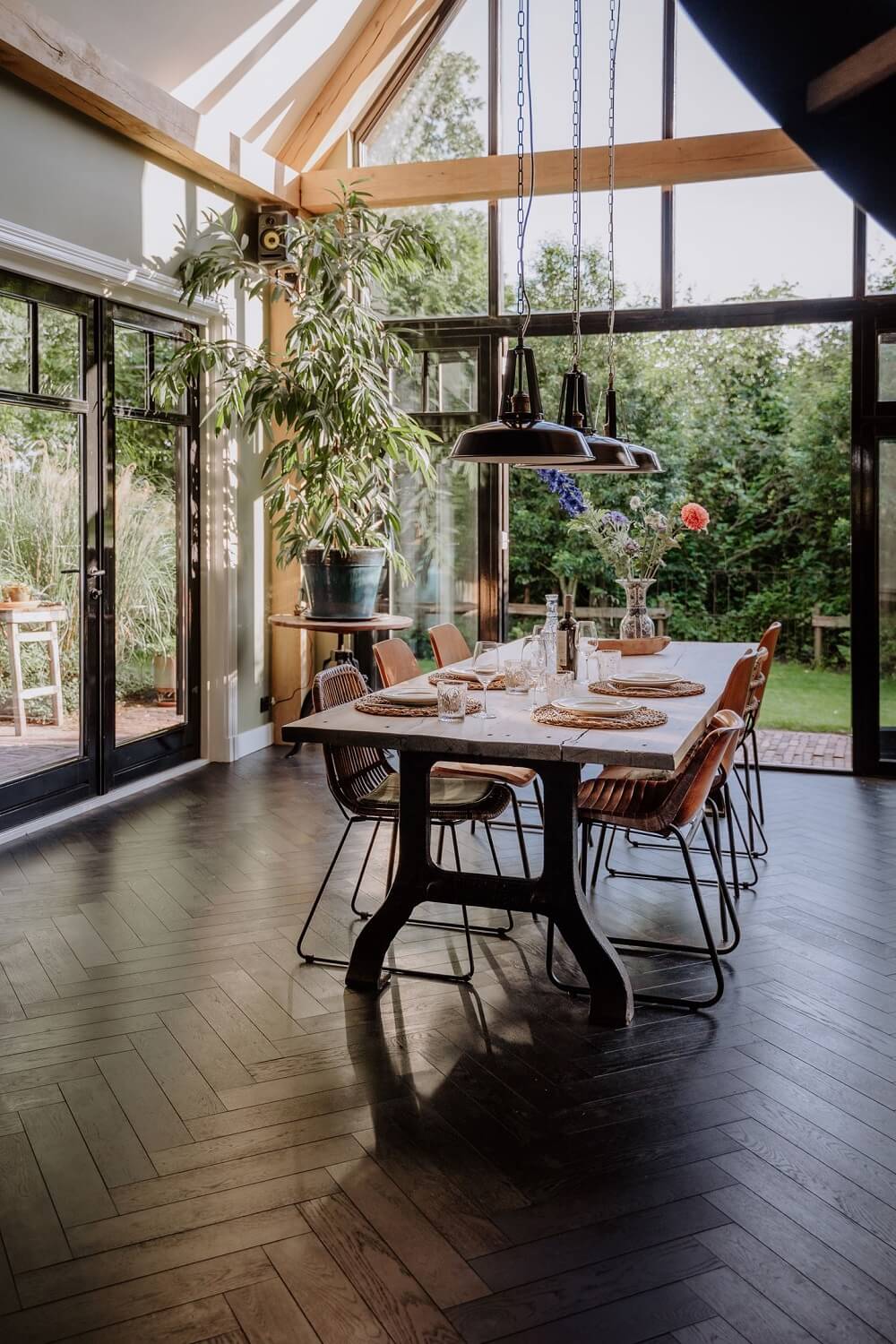 Best of 2024: Dining Rooms 10 dining room with piched ceiling glass wall and wooden beams