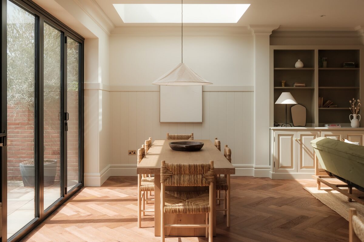 A Calm Color Palette and Warm Materials in a London Home 13 dining table under skylight
