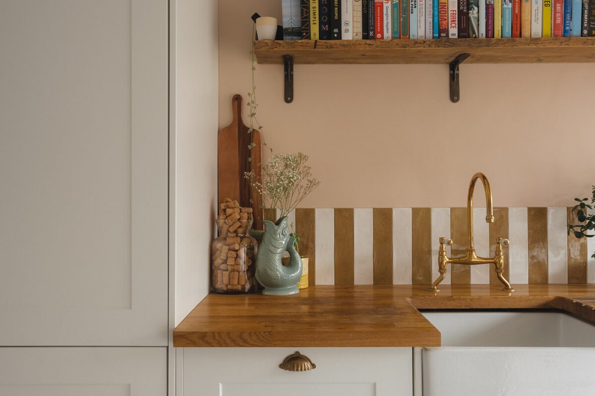 A Charming Victorian House with a Lovely Kitchen 3 gold white striped backsplash