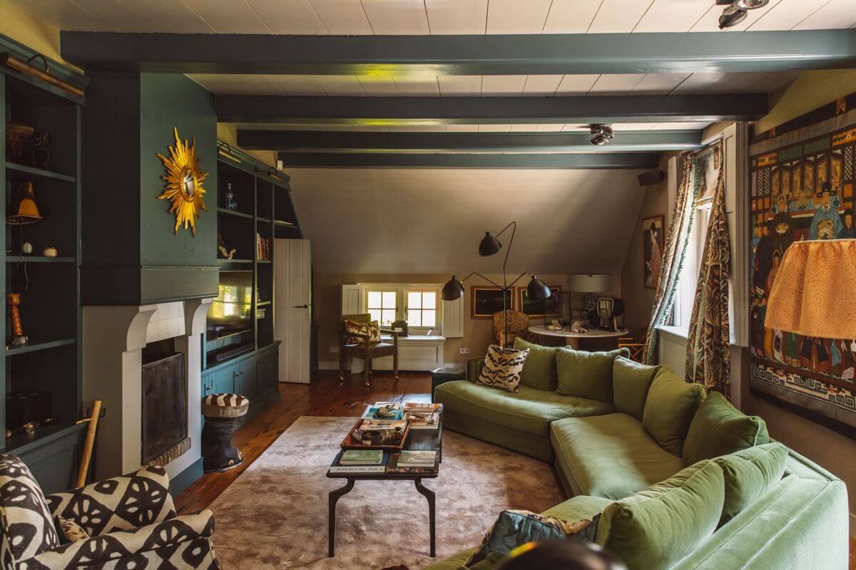 Best of 2024: Living Rooms 37 green living room with wooden beams and large velvet sofa