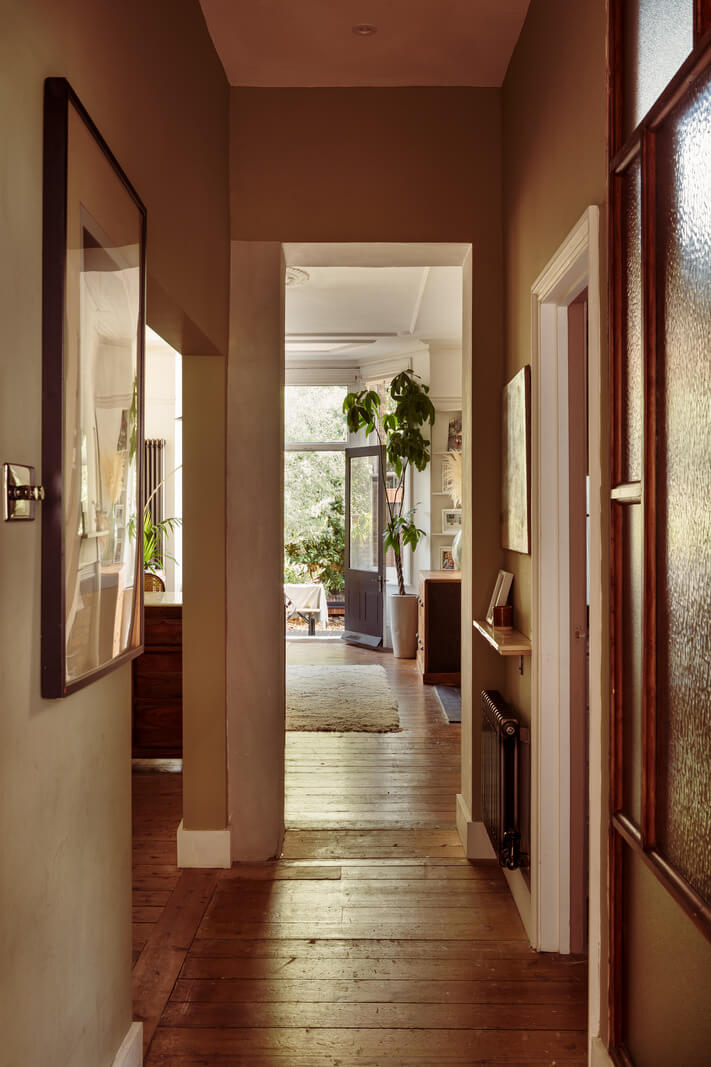 A Warm Ground Floor Apartment with Reclaimed Materials 16 hallway brown walls
