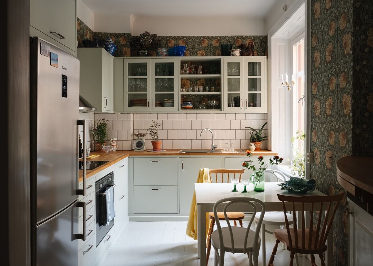 An Apartment with William Morris Wallpaper and a Dull Plum Bedroom 1 kitchen with light green cabinets and william morris pimpernel wallpaper nordroom