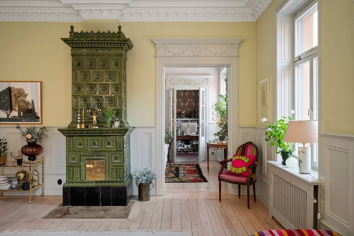Bright, Spacious Rooms in a Classic Stockholm Apartment 5 living room green fireplace