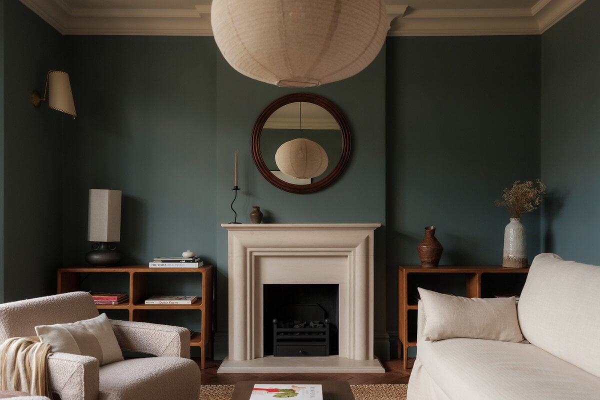 A Calm Color Palette and Warm Materials in a London Home 1 moody living room with fireplace and light furnishings