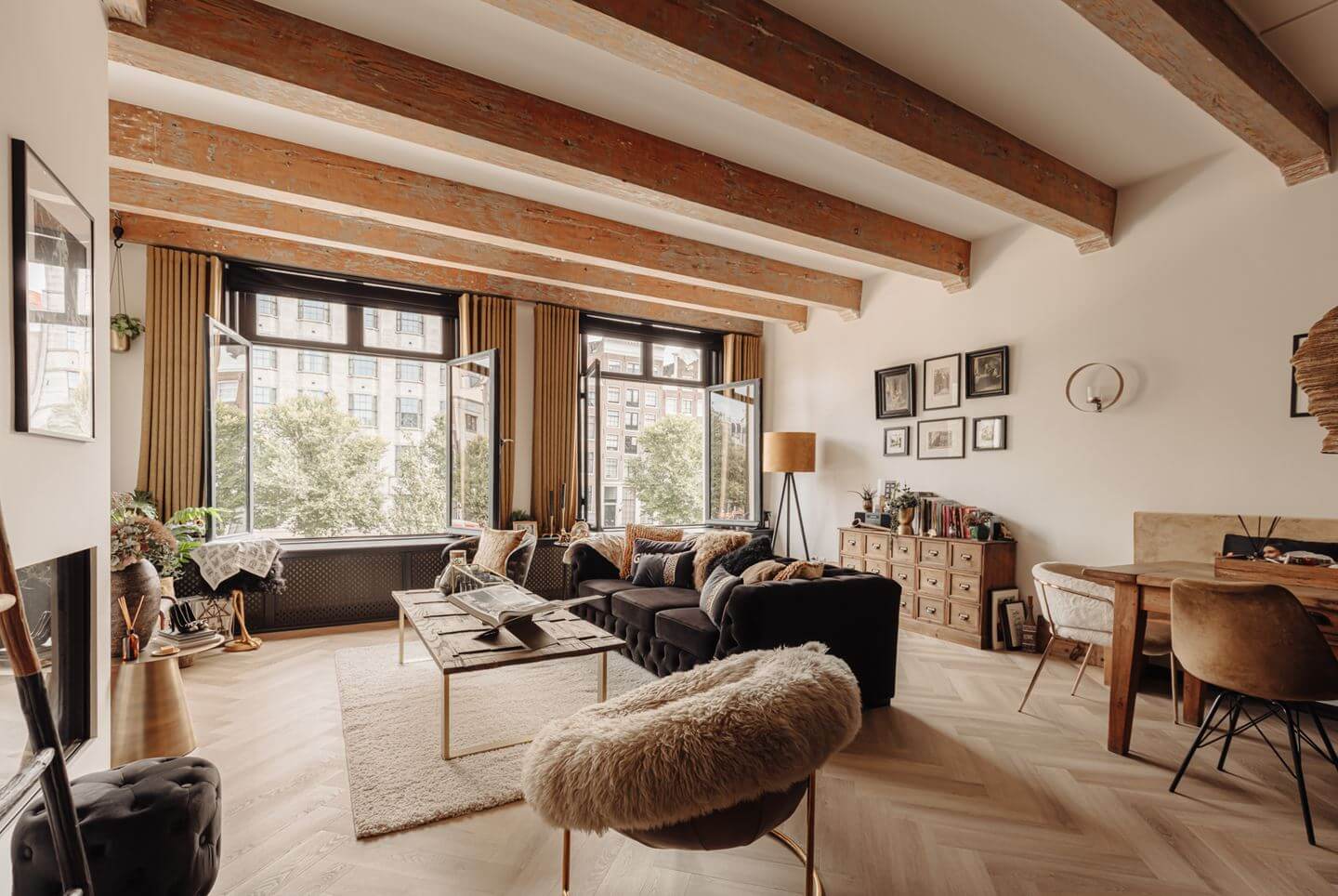 A Charming Apartment in a Historic Canal House 1 warm living room wooden ceiling beams