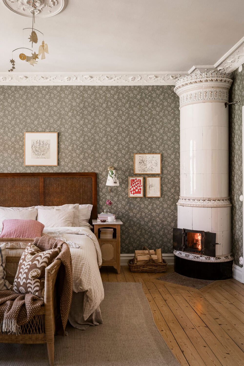 Hannes Mauritzson's Warm Yellow Hygge Apartment in Sweden 11 bedroom Hip Rose Boråstapeter wallpaper wooden floor fireplace