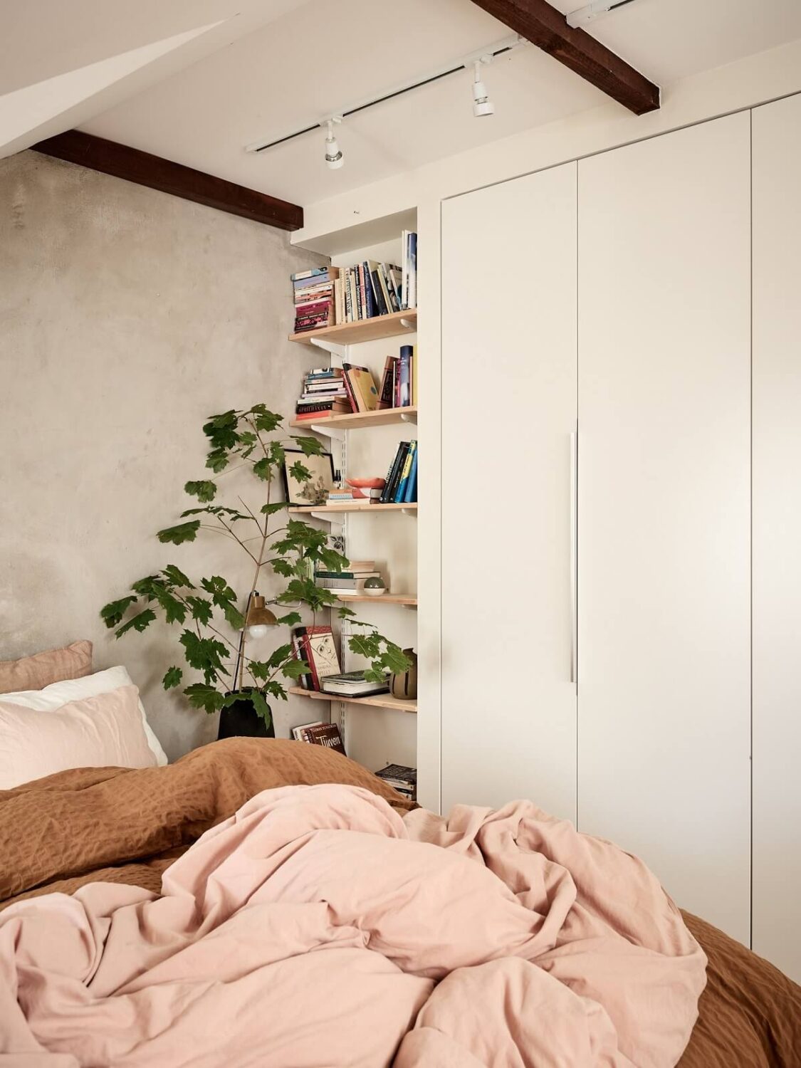 A Light Two-Bedroom Attic Apartment in Sweden 13 bedroom built in wardrobes and bookshelves