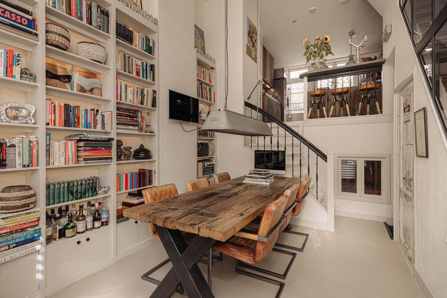 A Charming Amsterdam Townhouse with a Cozy Roof Terrace 1 dining room bookshelves high ceilings